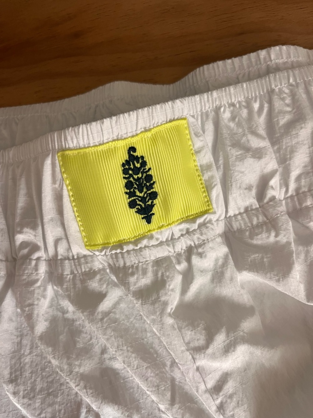 Free People White Athletic Shorts with Yellow Embroidered Patch